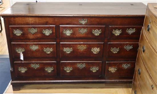 An 18th century oak and mahogany cross-banded chest, W.153cm